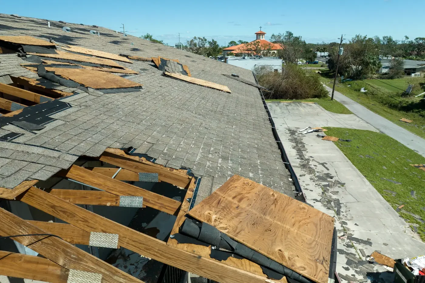 Damaged townhouse roof after hurricane in houston